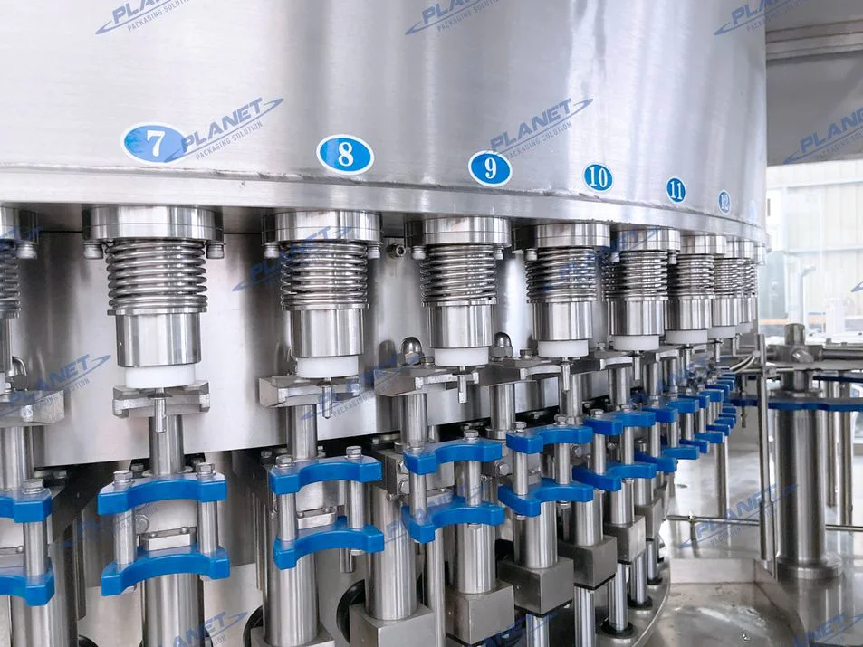 Close-up of fixed-level filling valves inside a PET bottled-water filling machine